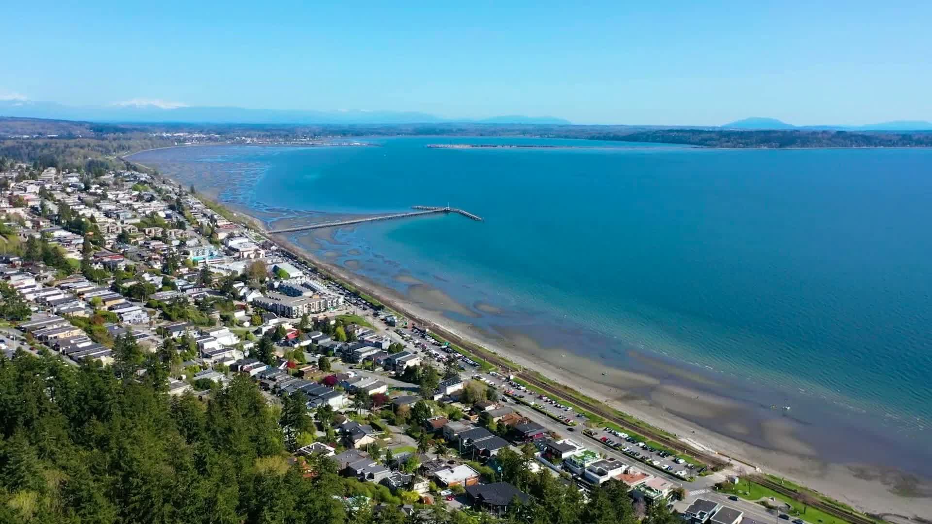 Aerial view of White Rock Beach and pier at golden hour